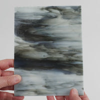 Video of the opal grey glass plate in grey translucent, 15x19cm, held up and tilted to show its pattern and transparency